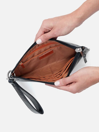 a black leather clutch with a wrist strap and zipper closure featuring organizational pouches inside