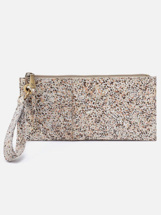 a terrazzo print leather clutch with a wrist strap and zipper closure