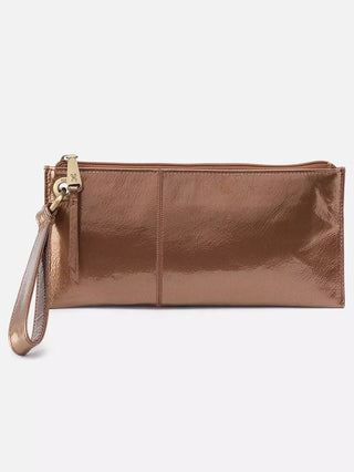 a leather wrist bag in metallic bronze with gold hardware perfect as an everyday small purse for fall and winter