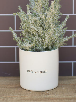 a christmas plant pot that reads peace on earth perfect for holiday home decor and as hostess gifts