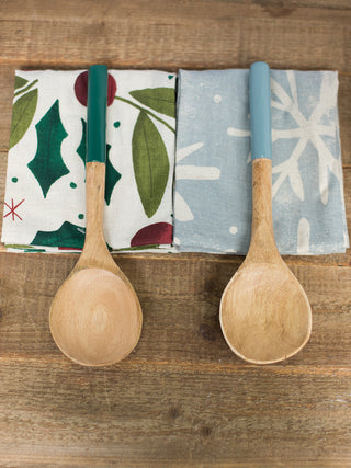 a christmas kitchen towel and wooden utensil set perfect for holiday home decor and as host gifts