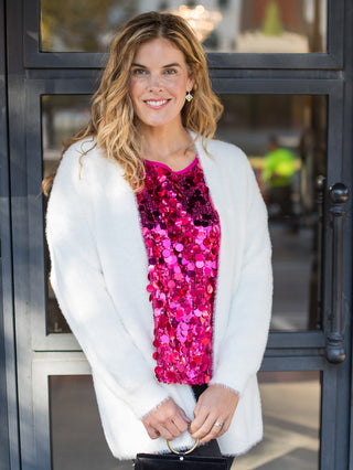 wear this fuzzy white open front cardigan to holiday and christmas gatherings for a chic and cozy look with denim pants