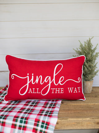 a red and white low back christmas pillow that read jingle all the way perfect for holiday home decor and hostess gifts