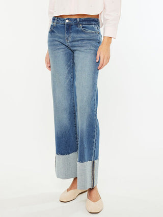 dark wash wide leg denim jeans with cuffed frayed hems