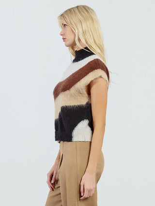 a fuzzy fur knitted sleeveless sweater a high neck and black neutral stripes