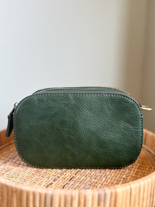 a vegan leather camera bag in emerald with an accompanying crossbody strap great to gift photography lovers