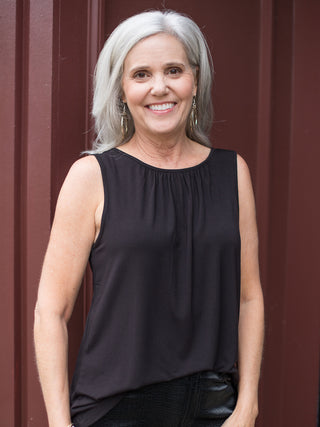 wear this slinky black tank top with feminine details as an essential winter layer or dress up for holiday parties 