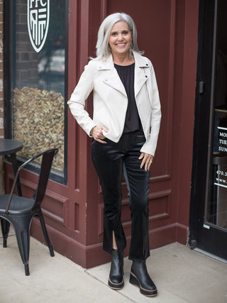 wear this slinky black tank top with feminine details as an essential layer or to holiday parties with black velvet pants