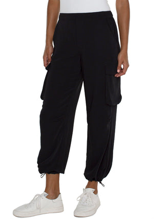 comfy matte black sateen cargo pants with loose fit parachute legs