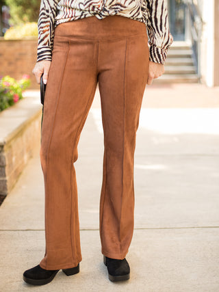 a pair of penny brown pants in faux suede with a seventies silhouette perfect for everyday fall fashion