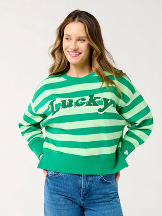 a st pattys day green striped sweater with the word lucky on the front