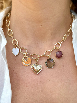 gold oval link chain necklace with unique charms