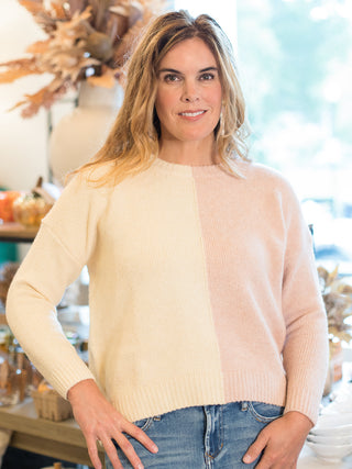 a colorblock sweater in cream and pale pink in a relaxed fit made to layer for fall winter and spring fashion