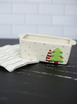 a beige christmas tree loaf pan with a striped towel perfect for holiday home decor and as host gifts