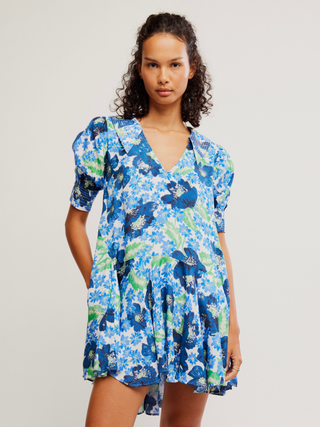 blue floral mini dress with short puff sleeves and deep v neck 