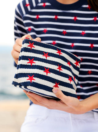 blue and white striped zip pouch with red stars