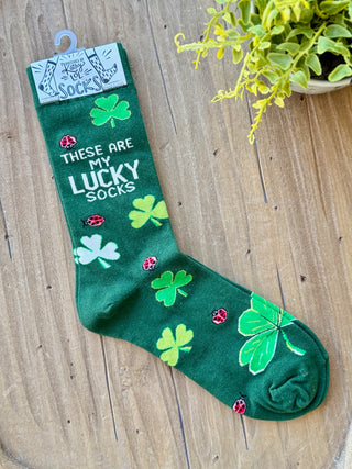 green st patricks day socks with a clover pattern that says these are my lucky socks