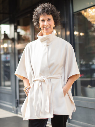 wear this dramatic cream cape poncho with cinched waist for glamorous holiday parties and family photoshoots
