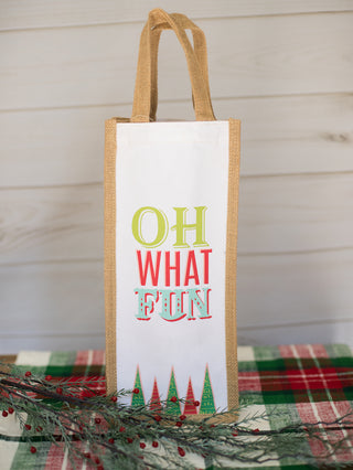 a natural wine bag that reads oh what fun with christmas trees perfect for holiday home decor and as host gifts