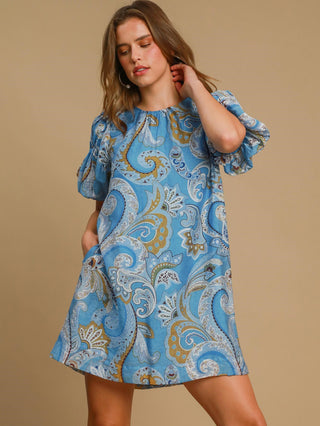 blue paisley mini dress with short puff sleeves and round neckline