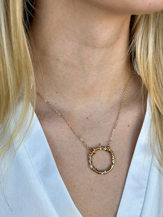 tiny gold chain necklace with round pendant with czs 