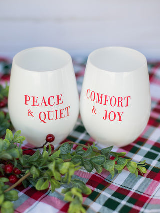 a pair of white and red stemless christmas wine glasses perfect for holiday home decor and stocking stuffer gifts