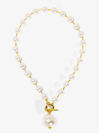 pearl necklace with a large pearl hanging from gold toggle 