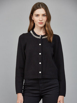 a black long sleeve button up cardigan with sparkling pearl and rhinestone accents