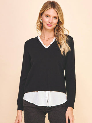 black knit sweater with built in button up white top and v neckline