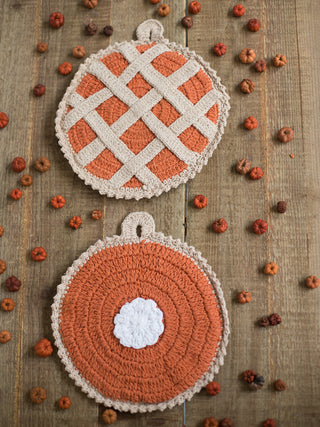 a pair of crochet knit pot holders in the design of pumpkin and sweet potato pies for fall home decor