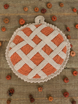 a crochet knit pot holder in the design of sweet potato pie for fall home decor