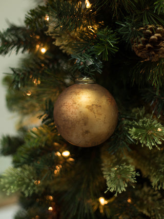 a vintage inspired gold christmas tree ornament made of mercury glass perfect for holiday home decor and hostess gifts