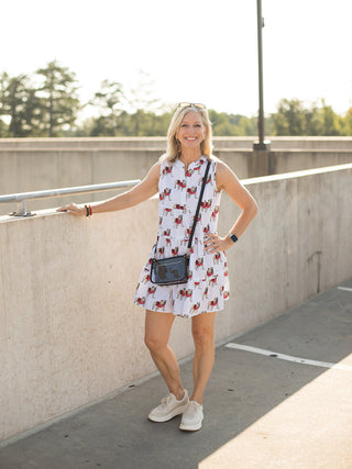 a white relaxed fit mini dress with university of georgia bulldog print perfect for football fashion shown with white sneakers