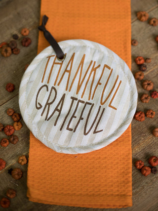 an off white pot holder that reads thankful and grateful perfect for fall and thanksgiving decor gifts