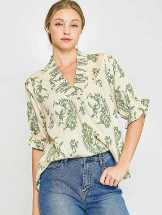 green and cream paisley print top with quarter length flutter sleeves and ruffled v neckline