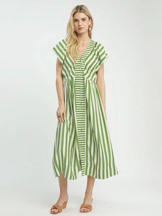 a flattering green striped flutter sleeve maxi dress worn with brown sandals