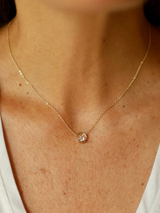 a subtle everyday gold necklace with a clear gemstone perfect for necklace layering