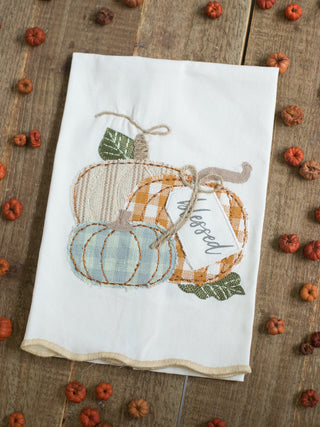 an off white hand towel with embroidered pumpkins that reads blessed perfect for fall and thanksgiving decor