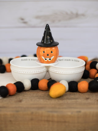 an illuminated pumpkin sitter perfect for halloween parties and host gifts shown with double dip dish