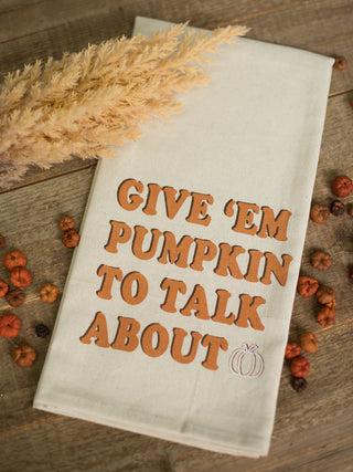 a cream and orange hand towel that reads give em pumpkin to talk about perfect for fall decor gifts