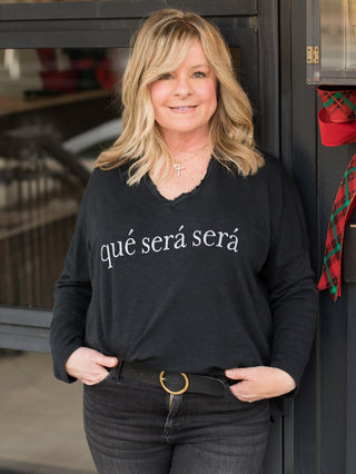 wear this black que sera sera top with long sleeves and a raw edge v neckline for chic comfort loungewear