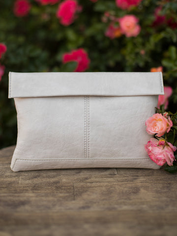 porcelain crossbody bag made of vegan leather with a wristlet included and fold-over zip closure to keep essentials secure