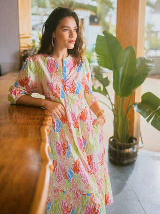 coral print colorful midi dress with billowy quarter length sleeves with an elastic band