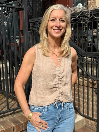 a warm earth beige cropped v neck tank with a cute twist