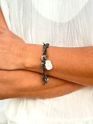 an edgy gunmetal washer chain link bracelet with a pearl pendant