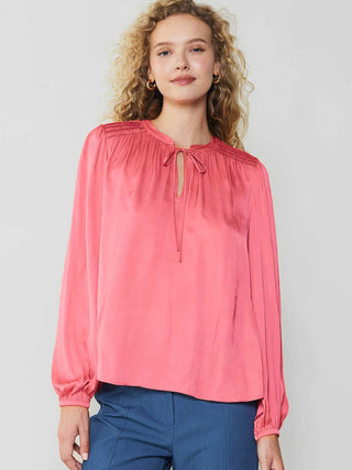 delicate bright pink split neck blouse with long puffed sleeves