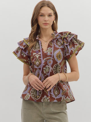 rusty red abstract print blouse with ruffle puff short sleeves and split v neck with front tie
