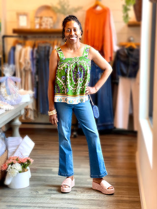 relaxed fit camisole top in a bright green mezzo tile pattern with button back detail worn with jeans