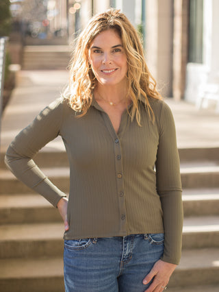 a forest green long sleeve button down ribbed top