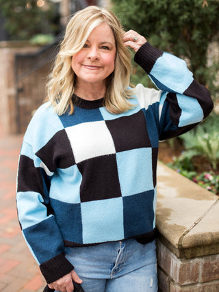 wear this multi colored blue sweater with checkered print for everyday winter wear or on holiday weekends